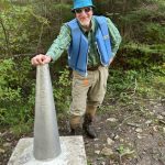 Happy owner of Barrel Organizers and Pack liner admiring the international boundary marker in the BWCA. Photo Credit: Bruce Kieffer