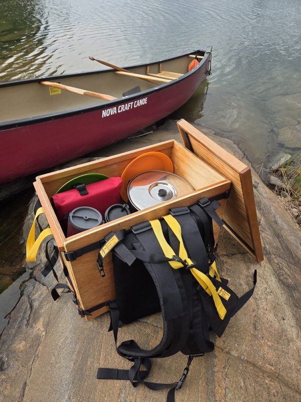 Wanigan with Harness on Trip with the lid open